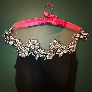 Long black formal dress with white floral detail neckline